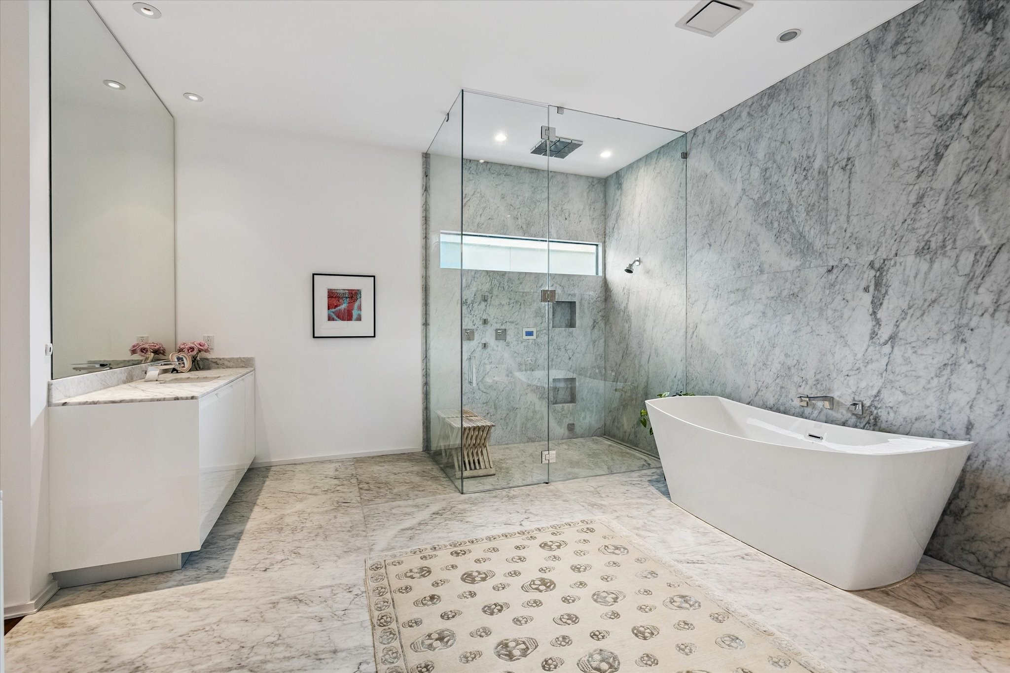1527 Indiana Street Houston, TX 77006 - Photo 20 of 30 Wrapped in floor-to-ceiling Carrera and Statuarietto marble, floors beautifully bookmatched.