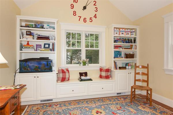 46 Coburn Hill Road Concord, MA 01742 - Photo 14 of 27 a bedroom with furniture and a book shelf