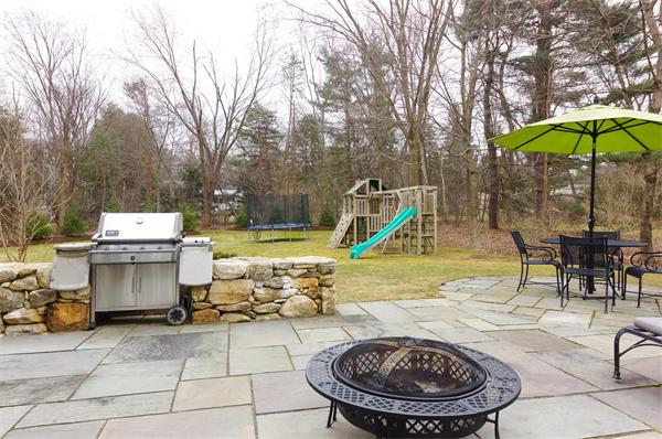 46 Coburn Hill Road Concord, MA 01742 - Photo 23 of 27 a view of a backyard with a table and chairs