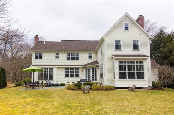 46 Coburn Hill Road Concord, MA 01742 - Photo 5 of 27 a front view of a house with swimming pool and porch with seating space