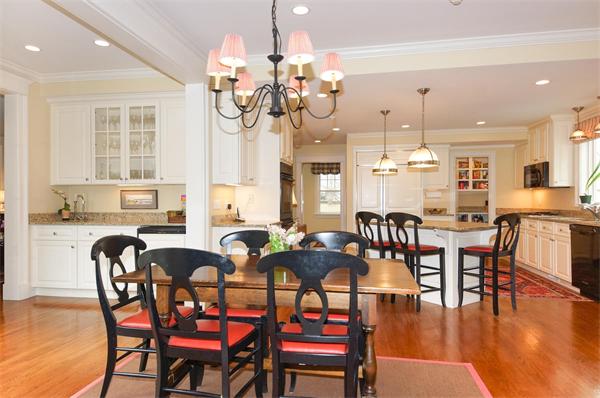 46 Coburn Hill Road Concord, MA 01742 - Photo 8 of 27 a dining room with wooden floor a chandelier a wooden table and chairs