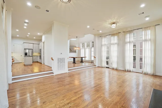 a view of a hall with wooden floor