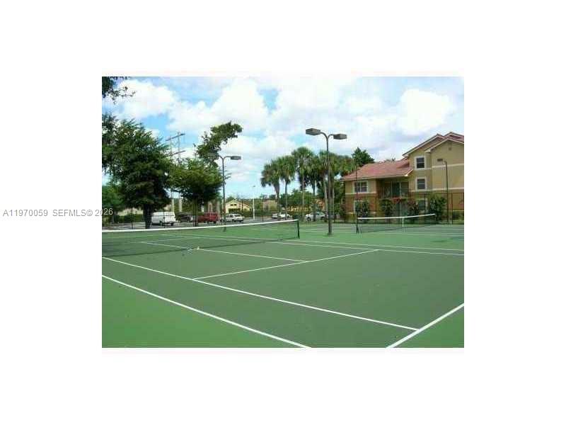 9001 Wiles Road, Unit 204 Coral Springs, FL 33067 - Photo 5 of 16 a view of a tennis court