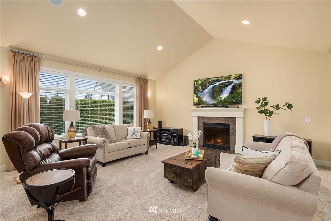 6753 Southeast 2nd Street Renton, WA 98059 - Photo 2 of 32 a living room with furniture fireplace and a large window