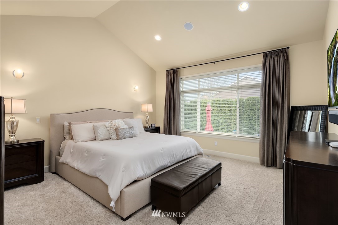 6753 Southeast 2nd Street Renton, WA 98059 - Photo 12 of 32 a large bedroom with a bed and large window