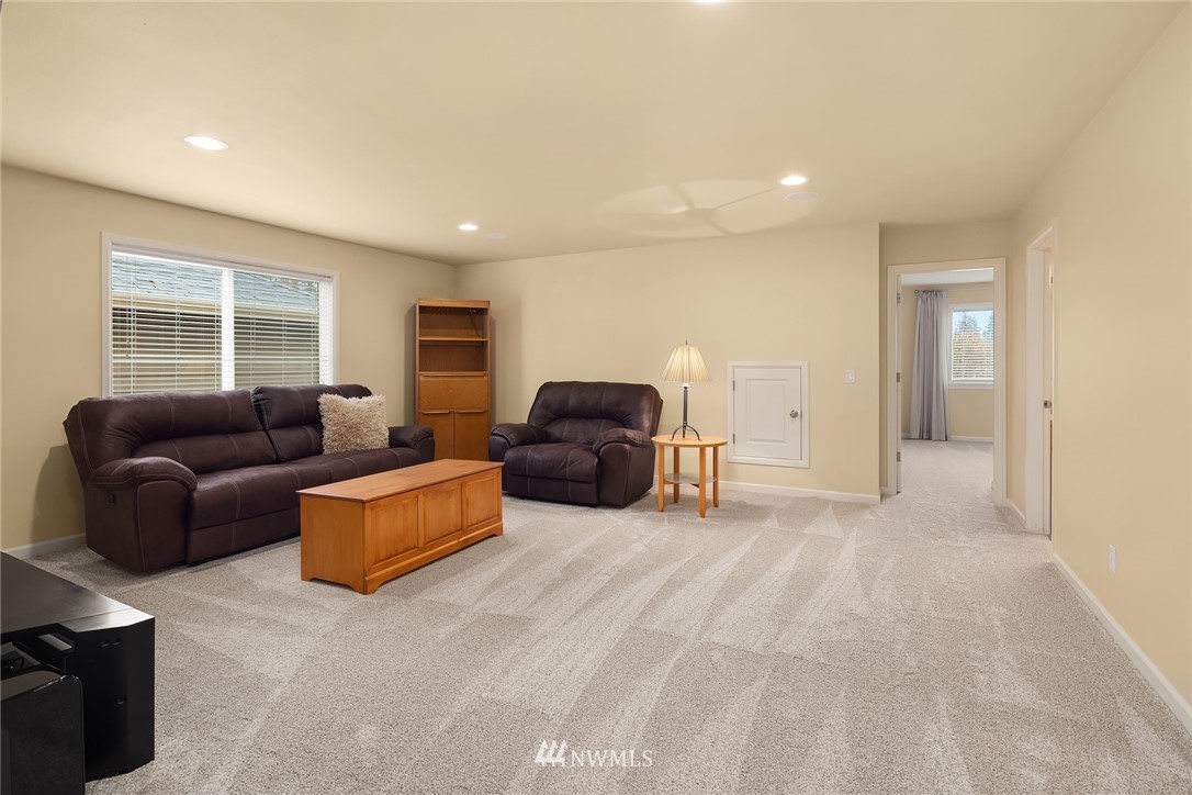 6753 Southeast 2nd Street Renton, WA 98059 - Photo 16 of 32 a living room with furniture a window and a couch