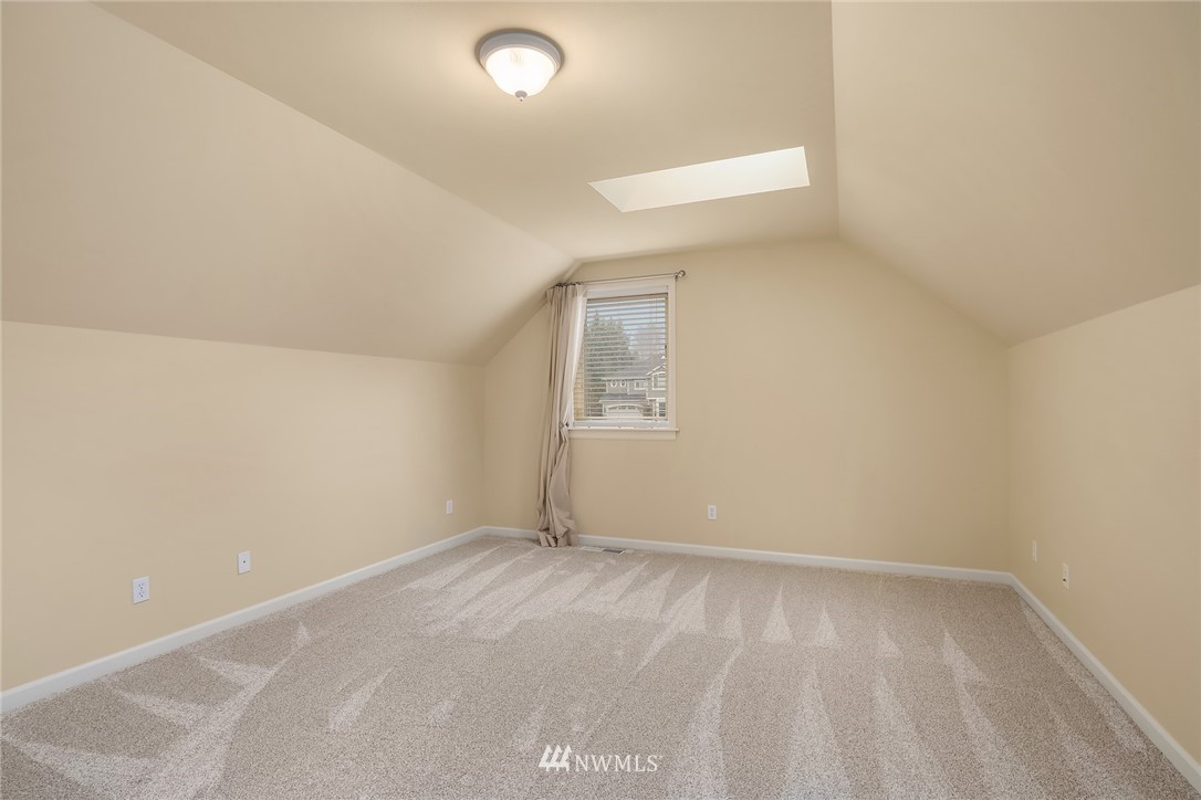 6753 Southeast 2nd Street Renton, WA 98059 - Photo 17 of 32 an empty room with a window