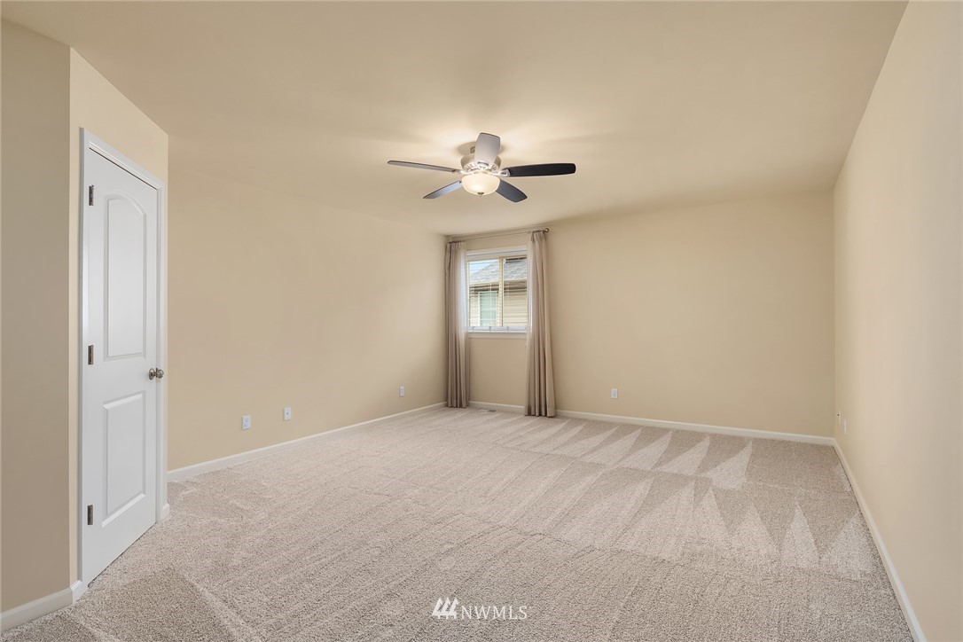 6753 Southeast 2nd Street Renton, WA 98059 - Photo 19 of 32 a view of an empty room with a ceiling fan