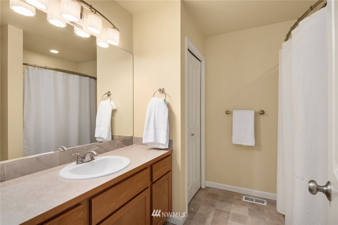 6753 Southeast 2nd Street Renton, WA 98059 - Photo 20 of 32 a bathroom with a sink and a mirror