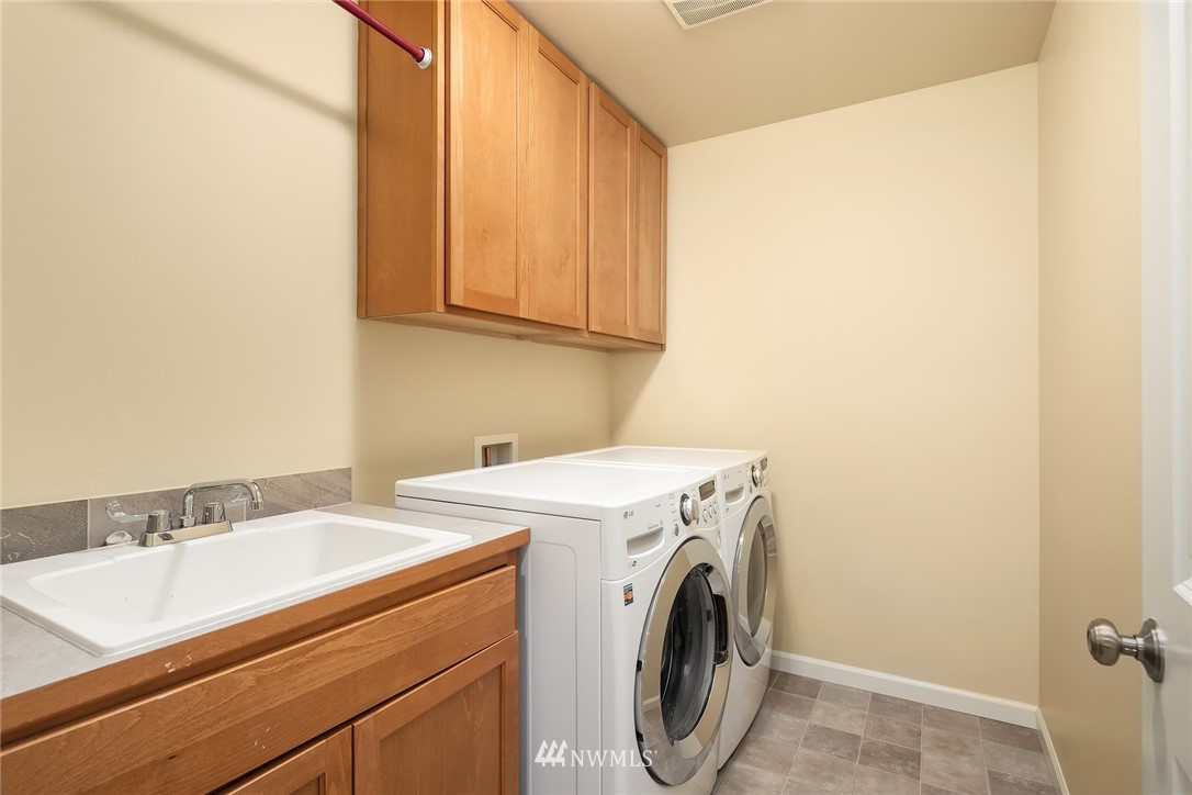 6753 Southeast 2nd Street Renton, WA 98059 - Photo 21 of 32 a utility room with dryer and washer
