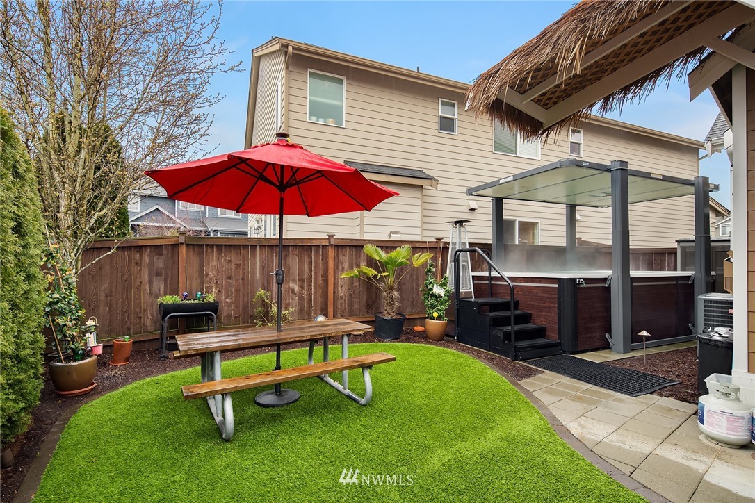 6753 Southeast 2nd Street Renton, WA 98059 - Photo 24 of 32 a view of a backyard with a patio and outdoor seating