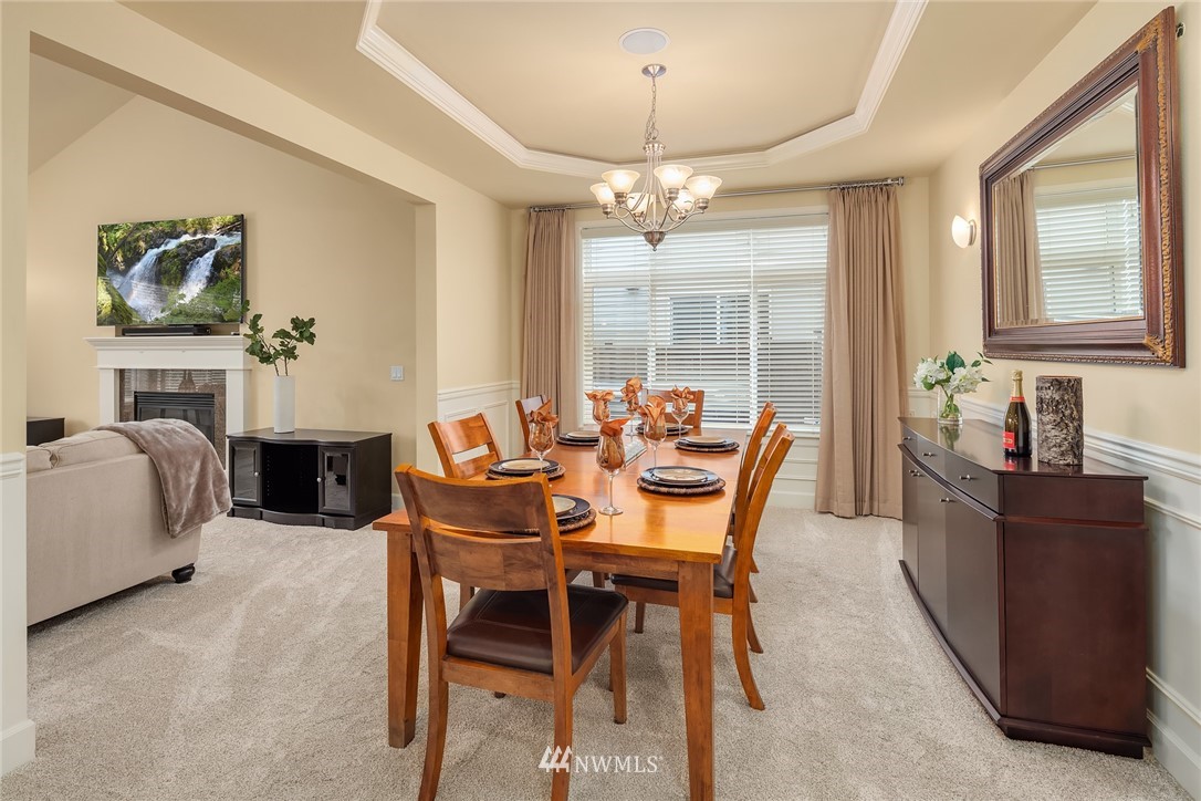 6753 Southeast 2nd Street Renton, WA 98059 - Photo 4 of 32 a view of a dining room with furniture window and outside view