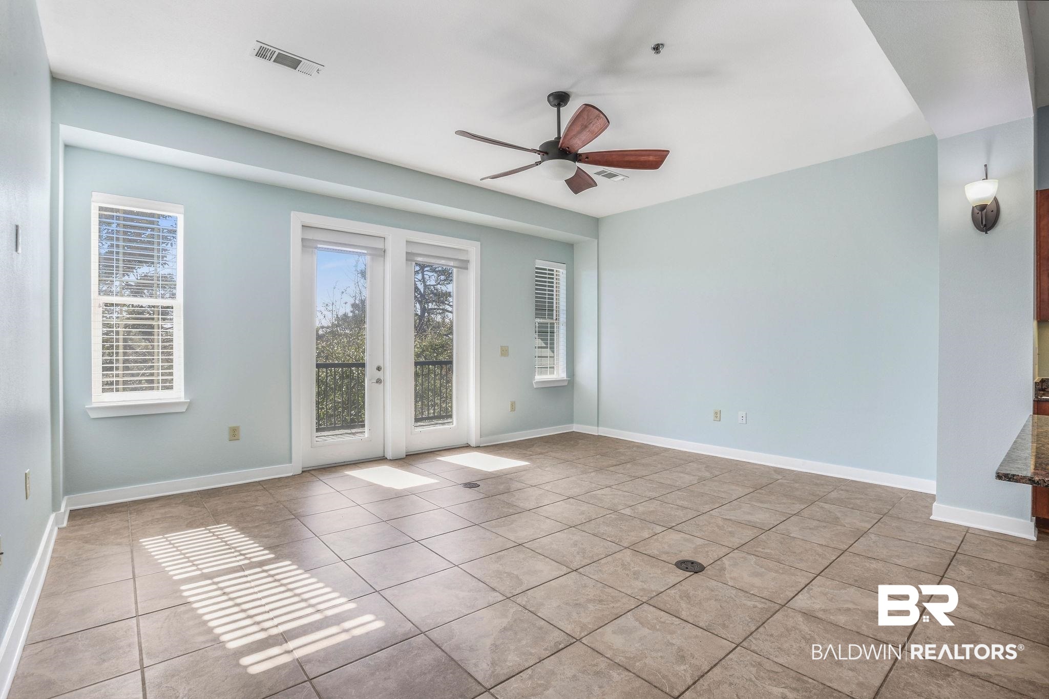1430 Regency Road, Unit B302 Gulf Shores, AL 36542 - Photo 5 of 24 Tiled spare room with a ceiling fan, visible vents, and baseboards