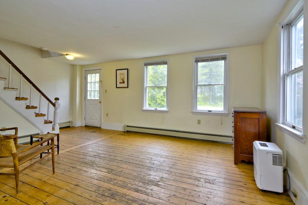 335 River Road Tenants Harbor, ME 04860 - Photo 3 of 12 Living room with stairs to the 2nd...