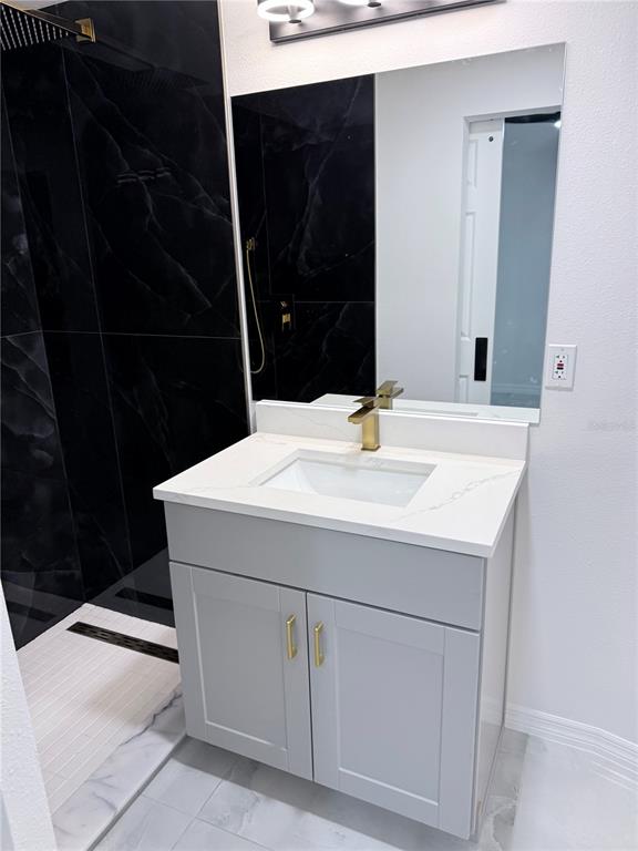 5025 Highway 54 New Port Richey, FL 34652 - Photo 20 of 39 a bathroom with a sink and a mirror