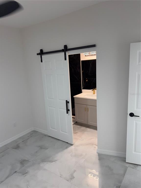 5025 Highway 54 New Port Richey, FL 34652 - Photo 25 of 39 a bathroom with a sink and a shower