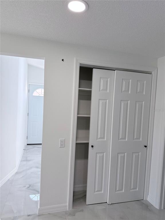 5025 Highway 54 New Port Richey, FL 34652 - Photo 34 of 39 a view of an empty room with a door