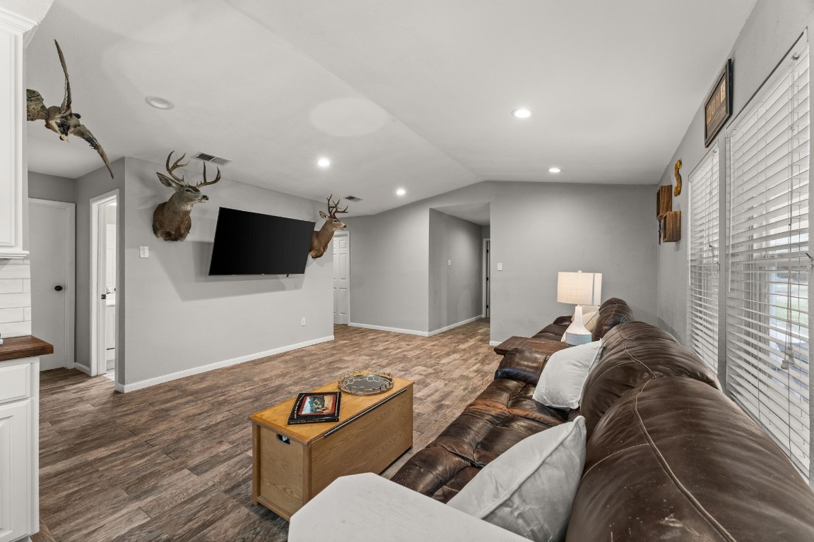 24906 Fawn Drive Leander, TX 78641 - Photo 11 of 39 a living room with furniture and a flat screen tv