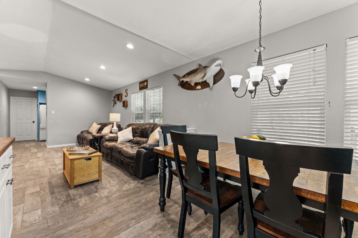 24906 Fawn Drive Leander, TX 78641 - Photo 13 of 39 a living room with couches chairs and kitchen view with wooden floor