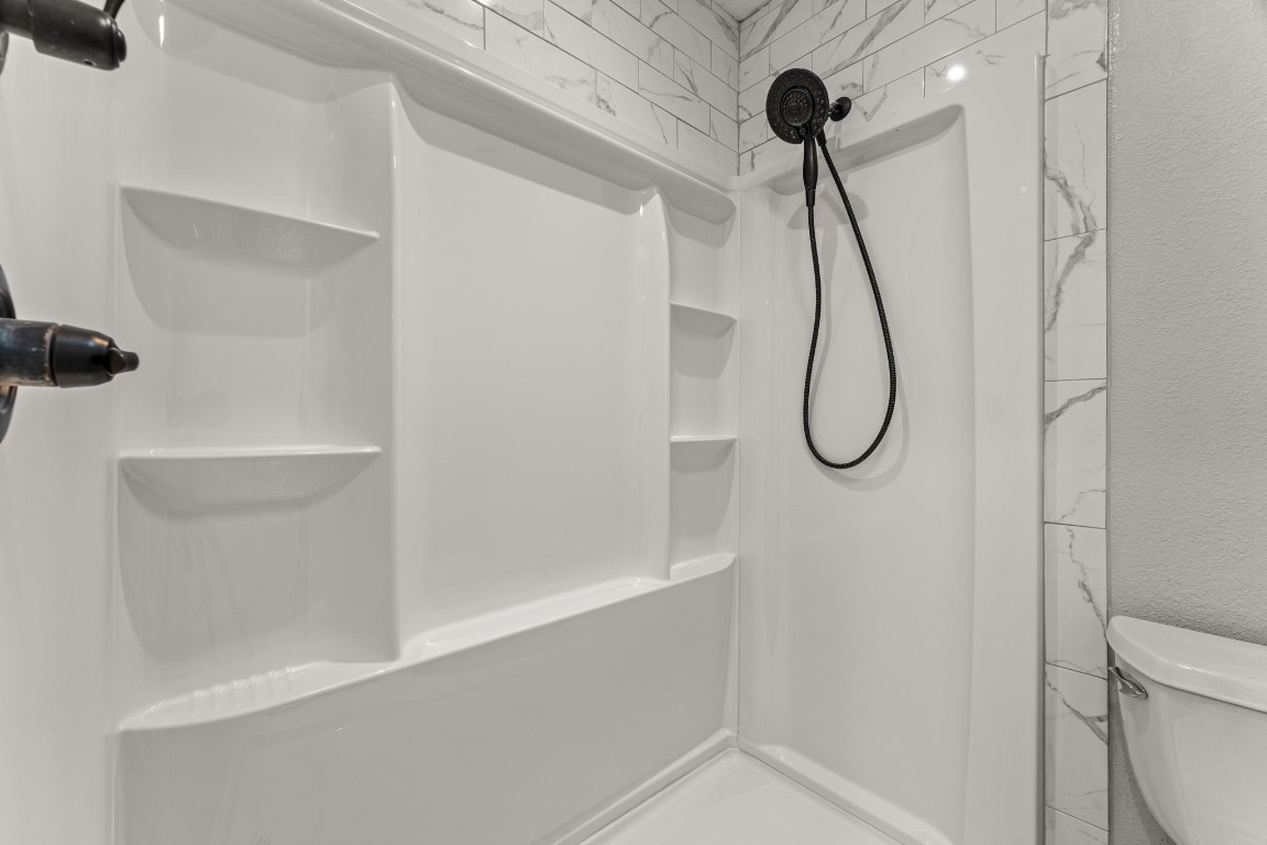 24906 Fawn Drive Leander, TX 78641 - Photo 20 of 39 a bathroom with a shower