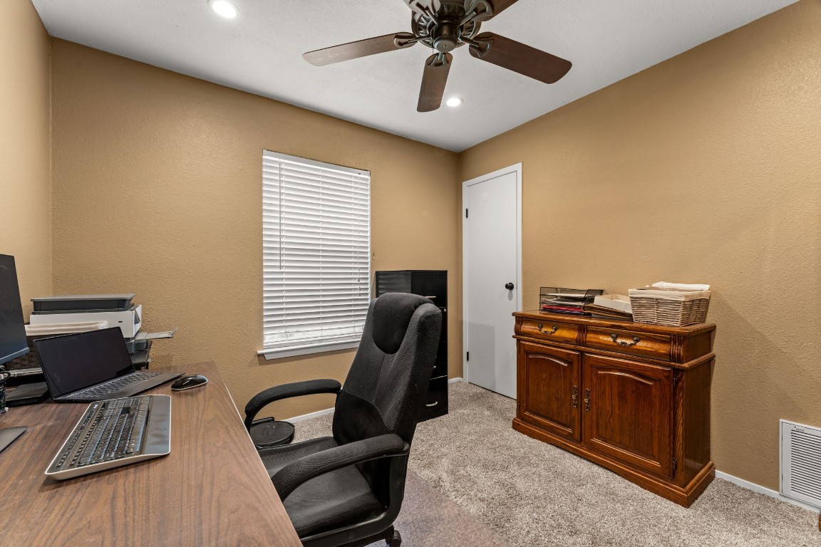 24906 Fawn Drive Leander, TX 78641 - Photo 23 of 39 a view of workspace with wooden floor windows