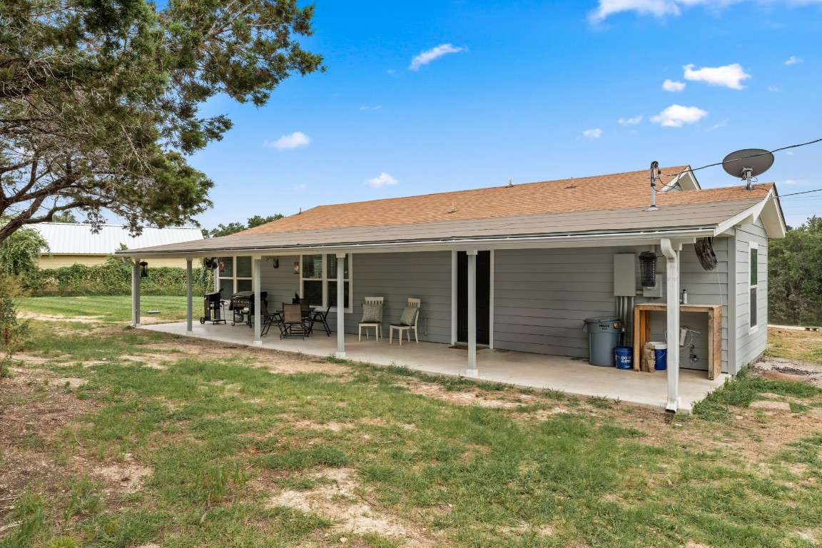 24906 Fawn Drive Leander, TX 78641 - Photo 28 of 39 a view of a house with a patio and a yard