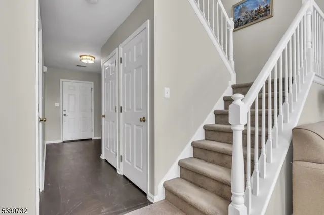 a view of an entryway with wooden floor