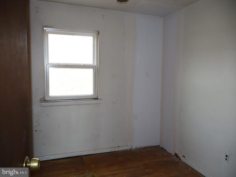 7028 Sheldrake Place Philadelphia, PA 19153 - Photo 11 of 11 an empty room with a window