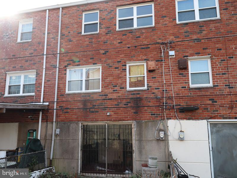 7028 Sheldrake Place Philadelphia, PA 19153 - Photo 2 of 11 a view of a brick building with many windows