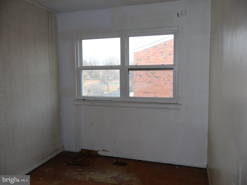 7028 Sheldrake Place Philadelphia, PA 19153 - Photo 10 of 11 an empty room with a window