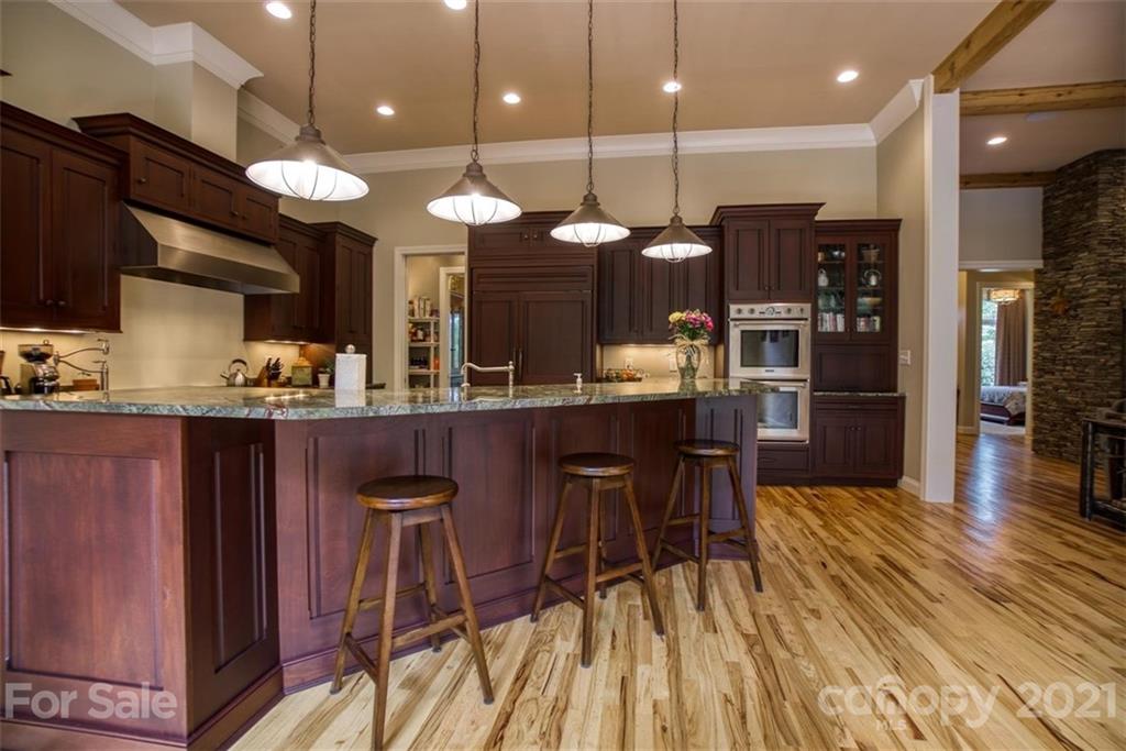 9658 Van Wyck Road Lancaster, SC 29720 - Photo 12 of 44 a kitchen with a table chairs refrigerator and microwave