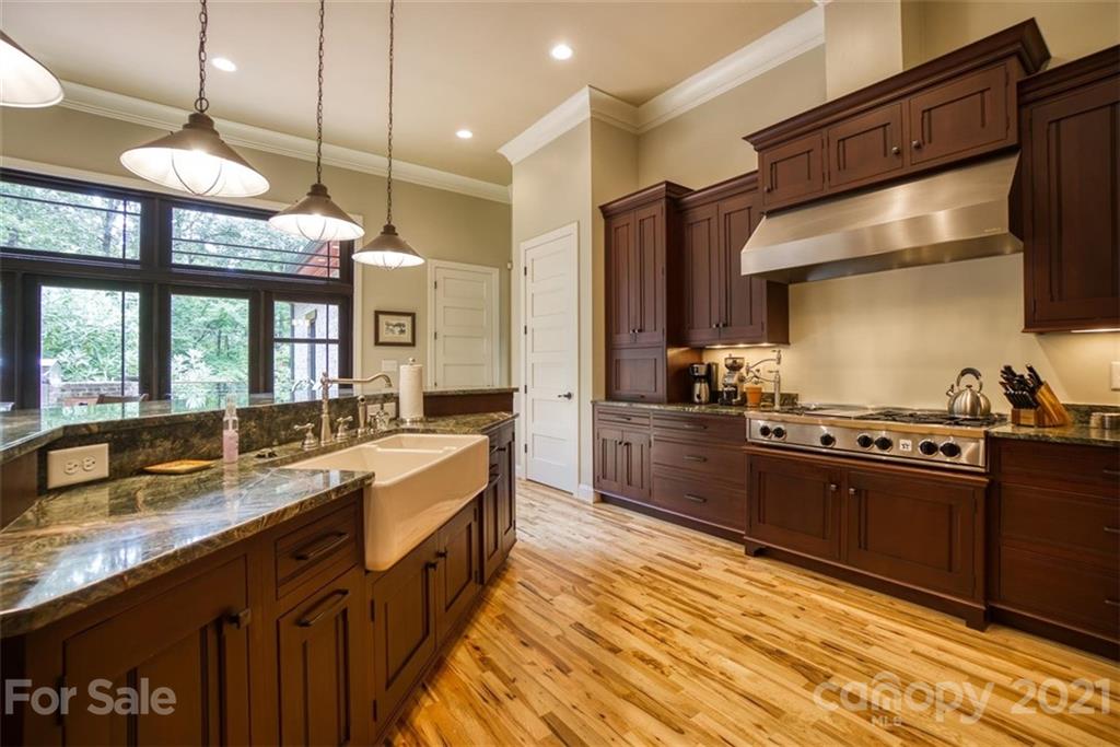 9658 Van Wyck Road Lancaster, SC 29720 - Photo 14 of 44 a large kitchen with stainless steel appliances granite countertop a sink and a stove