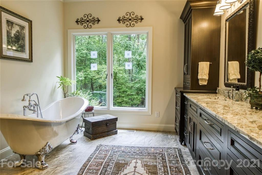 9658 Van Wyck Road Lancaster, SC 29720 - Photo 20 of 44 a spacious bathroom with a granite countertop tub sink and mirror