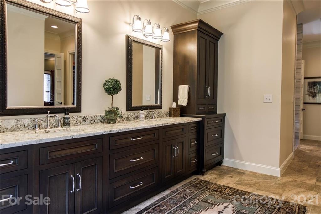 9658 Van Wyck Road Lancaster, SC 29720 - Photo 23 of 44 a bathroom with a double vanity sink and a mirror