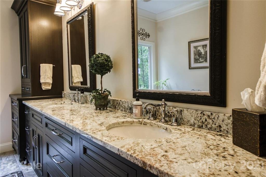 9658 Van Wyck Road Lancaster, SC 29720 - Photo 24 of 44 a bathroom with a granite countertop sink and a mirror