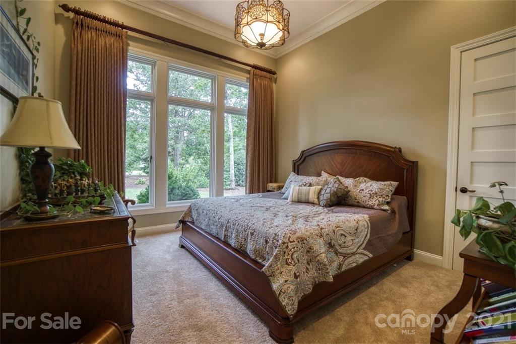 9658 Van Wyck Road Lancaster, SC 29720 - Photo 25 of 44 a bedroom with a bed and a potted plant
