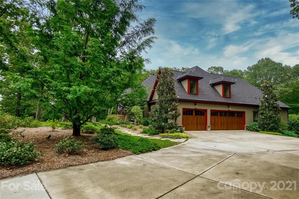 9658 Van Wyck Road Lancaster, SC 29720 - Photo 4 of 44 a front view of a house with a garden and trees