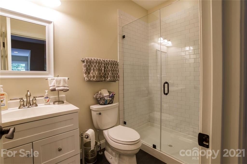 9658 Van Wyck Road Lancaster, SC 29720 - Photo 34 of 44 a bathroom with a toilet sink vanity and shower