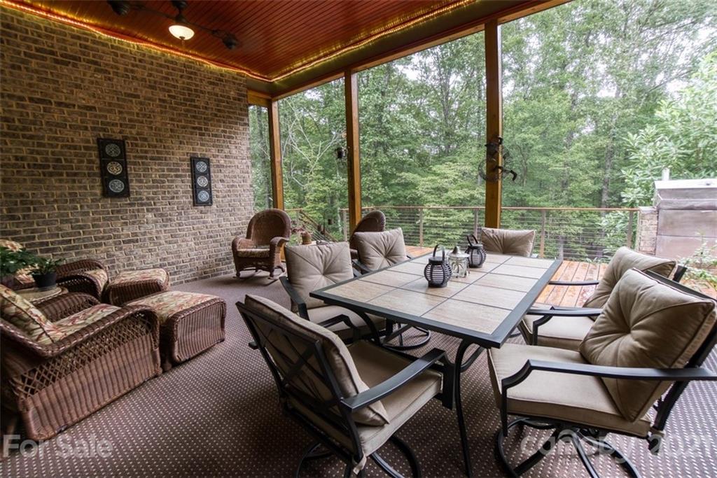9658 Van Wyck Road Lancaster, SC 29720 - Photo 35 of 44 a view of a patio with a dining table and chairs
