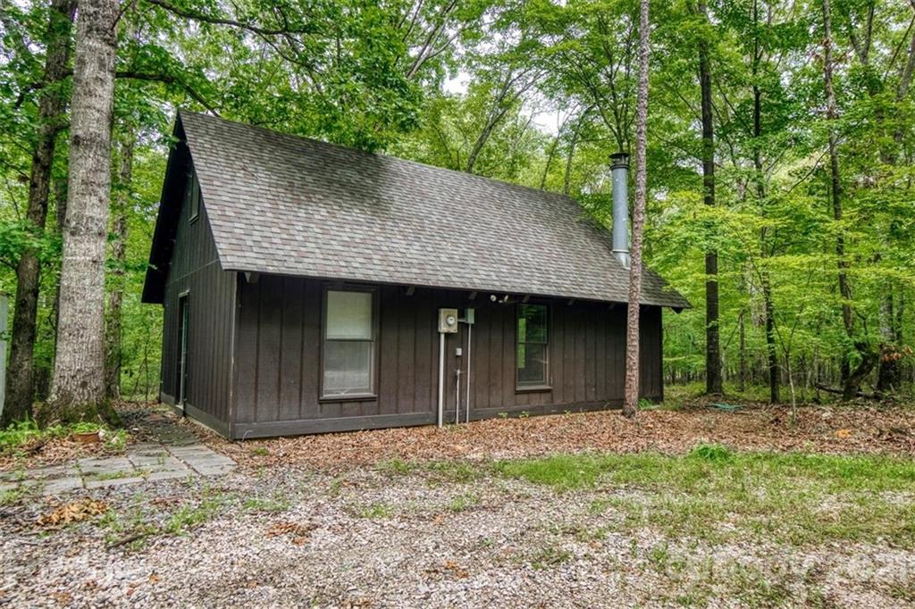 9658 Van Wyck Road Lancaster, SC 29720 - Photo 39 of 44 a backyard of a house with large trees and brick wall