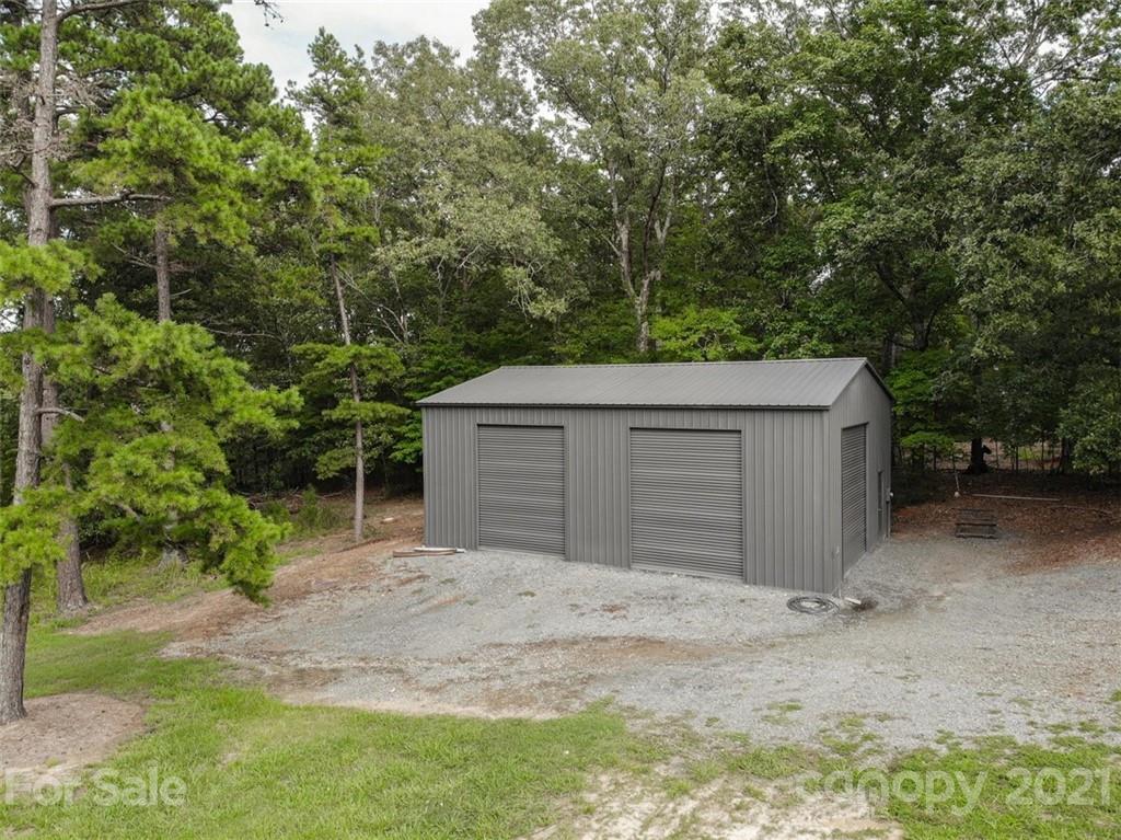 9658 Van Wyck Road Lancaster, SC 29720 - Photo 41 of 44 a house with trees in front of it