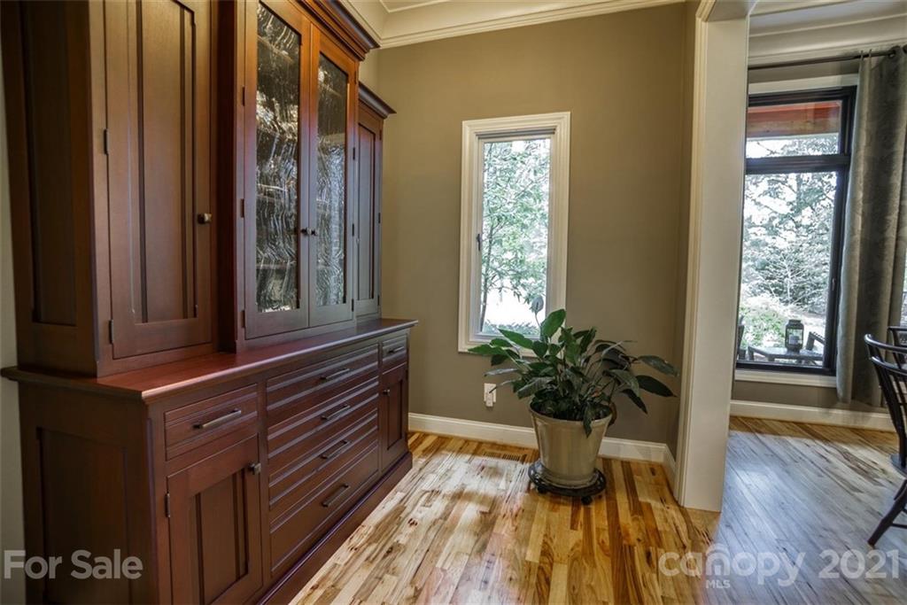 9658 Van Wyck Road Lancaster, SC 29720 - Photo 6 of 44 a dining room with wooden floor and a potted plant