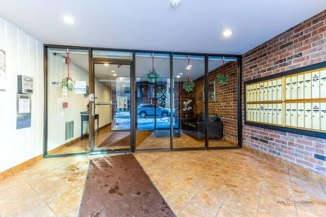 a view of a hall with wooden floor