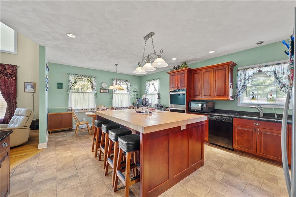292 Myoma Road Mars, PA 16046 - Photo 23 of 50 a kitchen with stainless steel appliances granite countertop a stove a sink dishwasher and a refrigerator