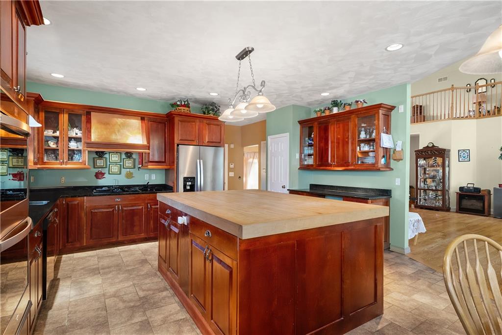 292 Myoma Road Mars, PA 16046 - Photo 24 of 50 a kitchen with stainless steel appliances granite countertop sink stove top oven and cabinets