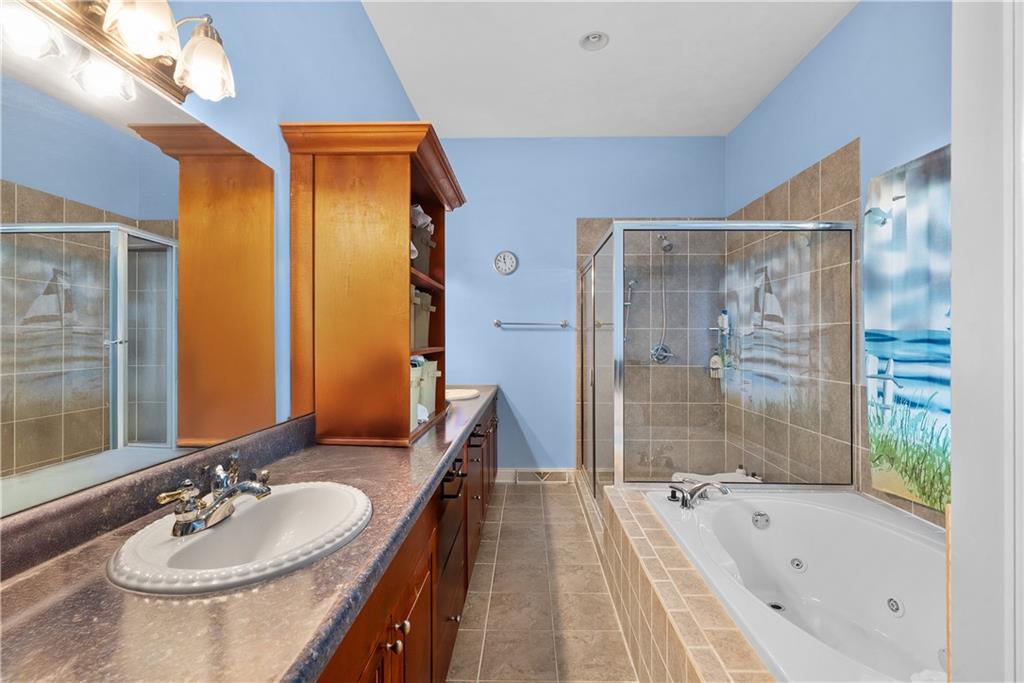 292 Myoma Road Mars, PA 16046 - Photo 30 of 50 a bathroom with a tub sink and mirror