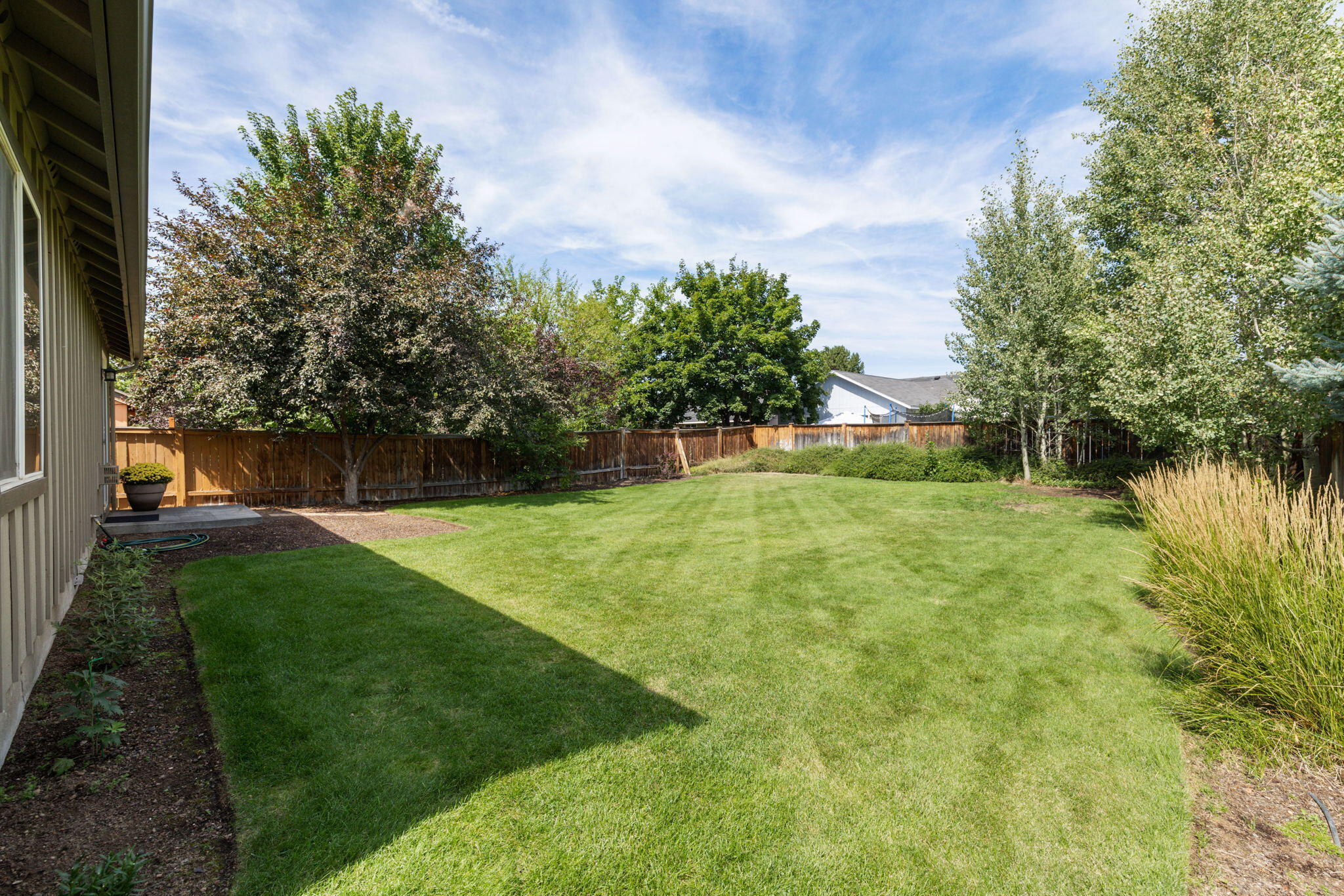 3108 Yellow Ribbon Drive Bend, OR 97701 - Photo 22 of 36 a view of a garden with a fountain in the background