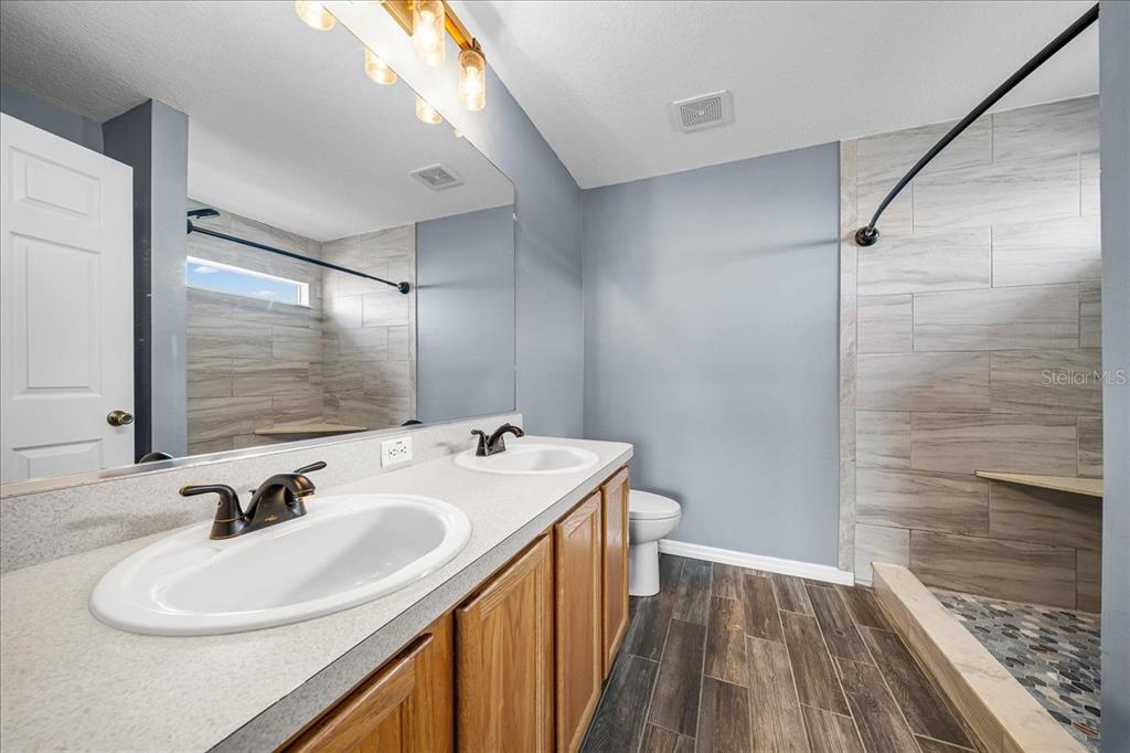 155 Juniper Way Ocala, FL 34480 - Photo 20 of 67 a bathroom with a sink and a mirror