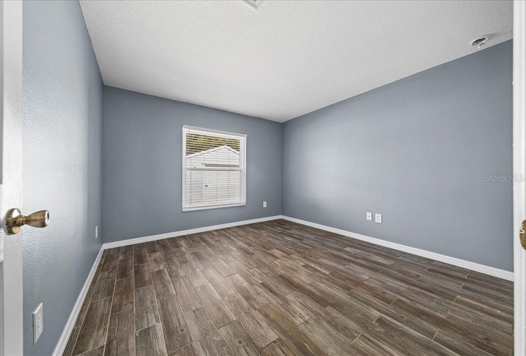 155 Juniper Way Ocala, FL 34480 - Photo 26 of 67 a view of room with window and hardwood floor