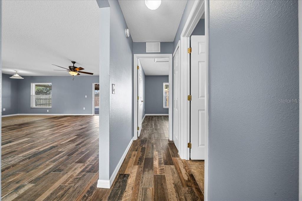 155 Juniper Way Ocala, FL 34480 - Photo 28 of 67 a view of a hallway with wooden floor and staircase
